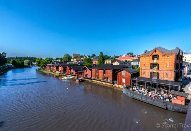 Porvoo Old Town red wooden riverside warehouses along Porvoonjoki River in Finland during a day trip