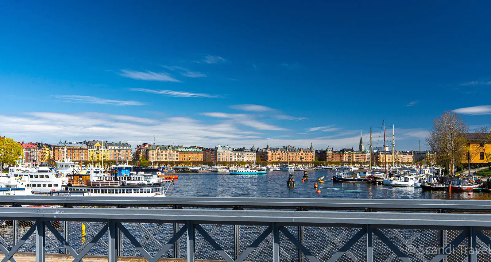 Stockholm waterfront harbour with boats and colourful historic buildings – Nordic countries tour