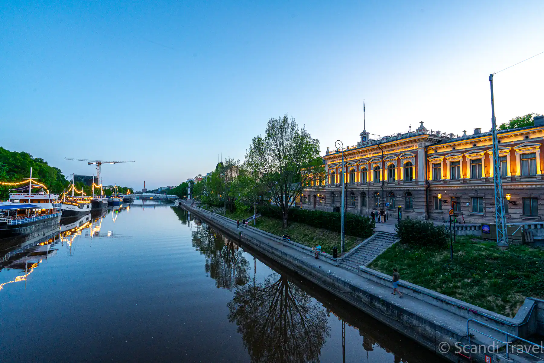 Turku City Hall and the Aura River on a summer evening, a stop on the 8-day Northern Europe tour from Stockholm
