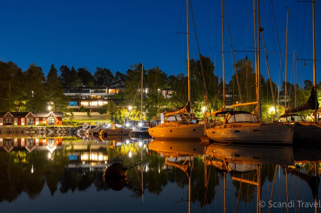 Cozy evening at Espoo marina near Helsinki with yachts and reflections