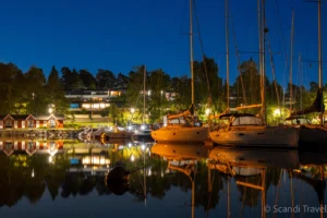 Cozy evening at Espoo marina near Helsinki with yachts and reflections