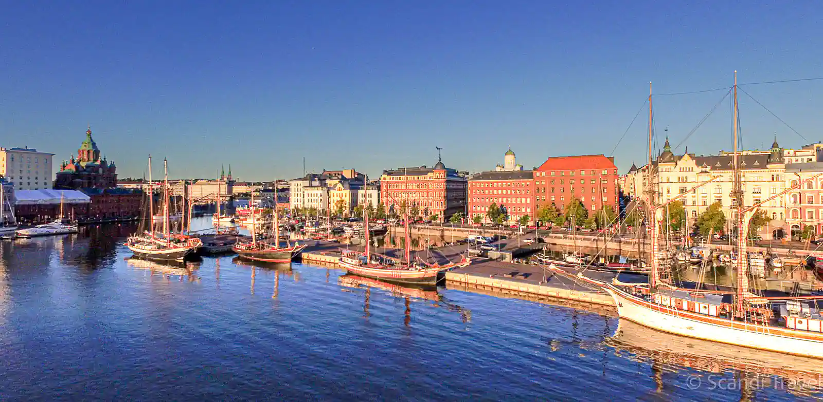Helsinki South Harbor with Uspenski Cathedral and traditional sailing ships during an 8-day Finland summer tour.