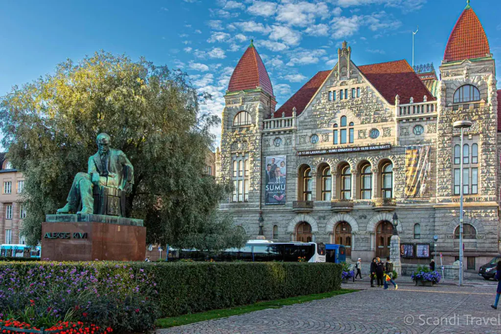 The Finnish National Theatre and Aleksis Kivi statue in Helsinki during a private guided walking tour.