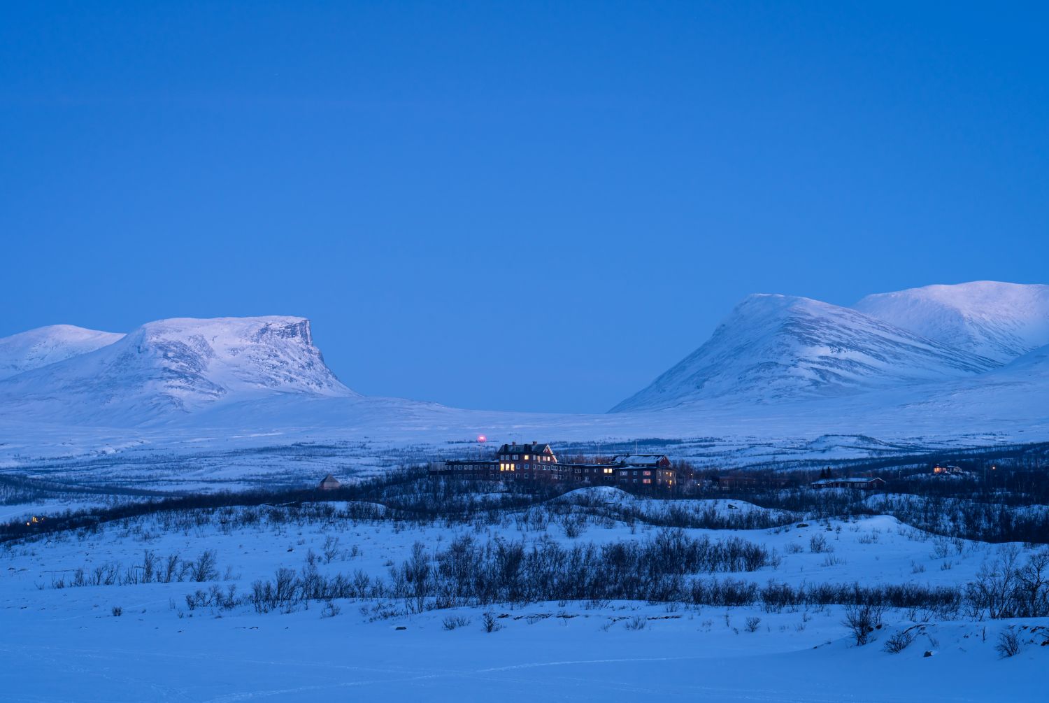 Dusk at the small town of Abisko and the famous Lapporten in winter.