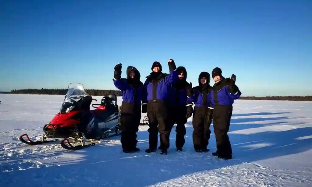 Traveller dressed in full winter layering system for a Lapland winter tour in sub-zero temperatures